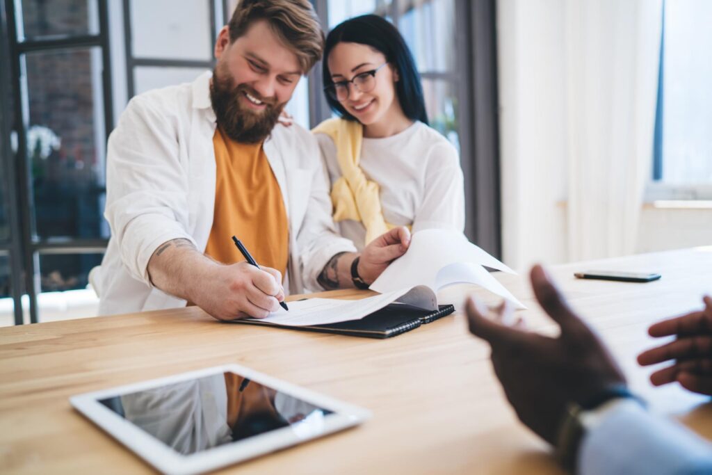 Couple signing mortgage documents