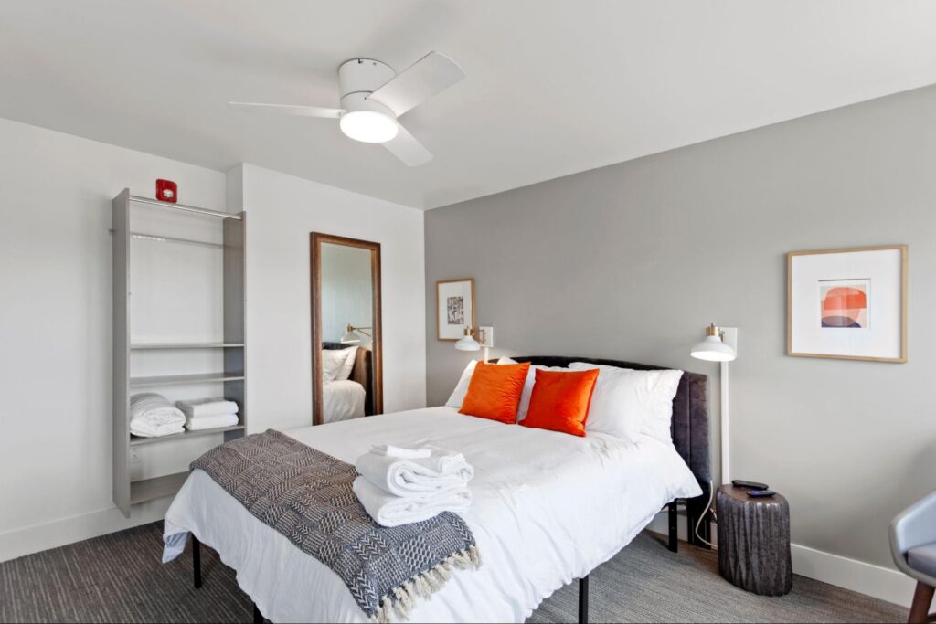 A furnished bedroom in a mid-term rental.