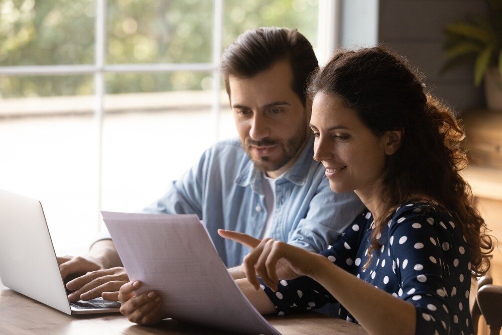 Couple reviewing loan programs.