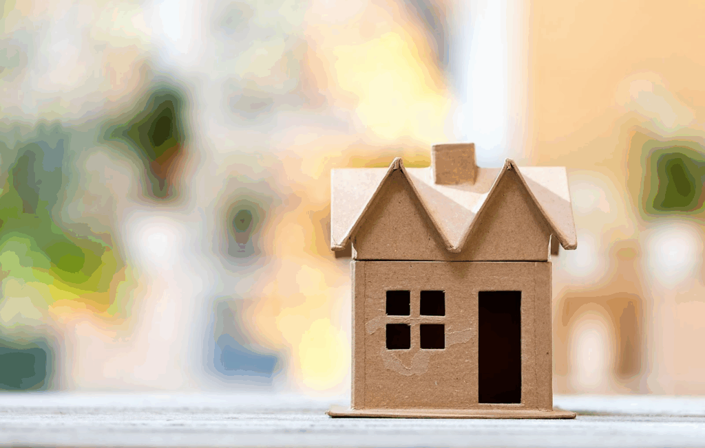 A cardboard model of a home.